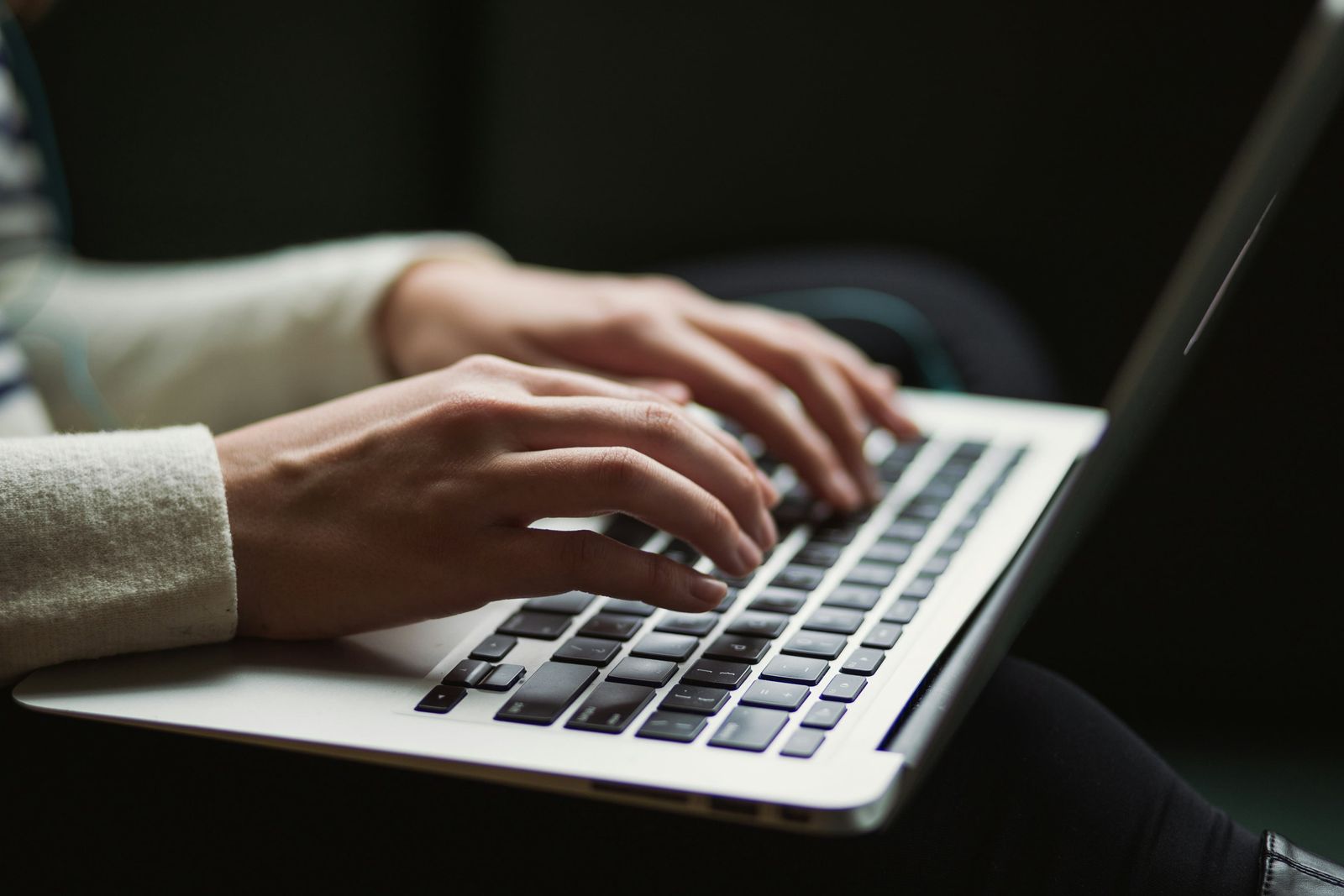 A workspace with a laptop and notes